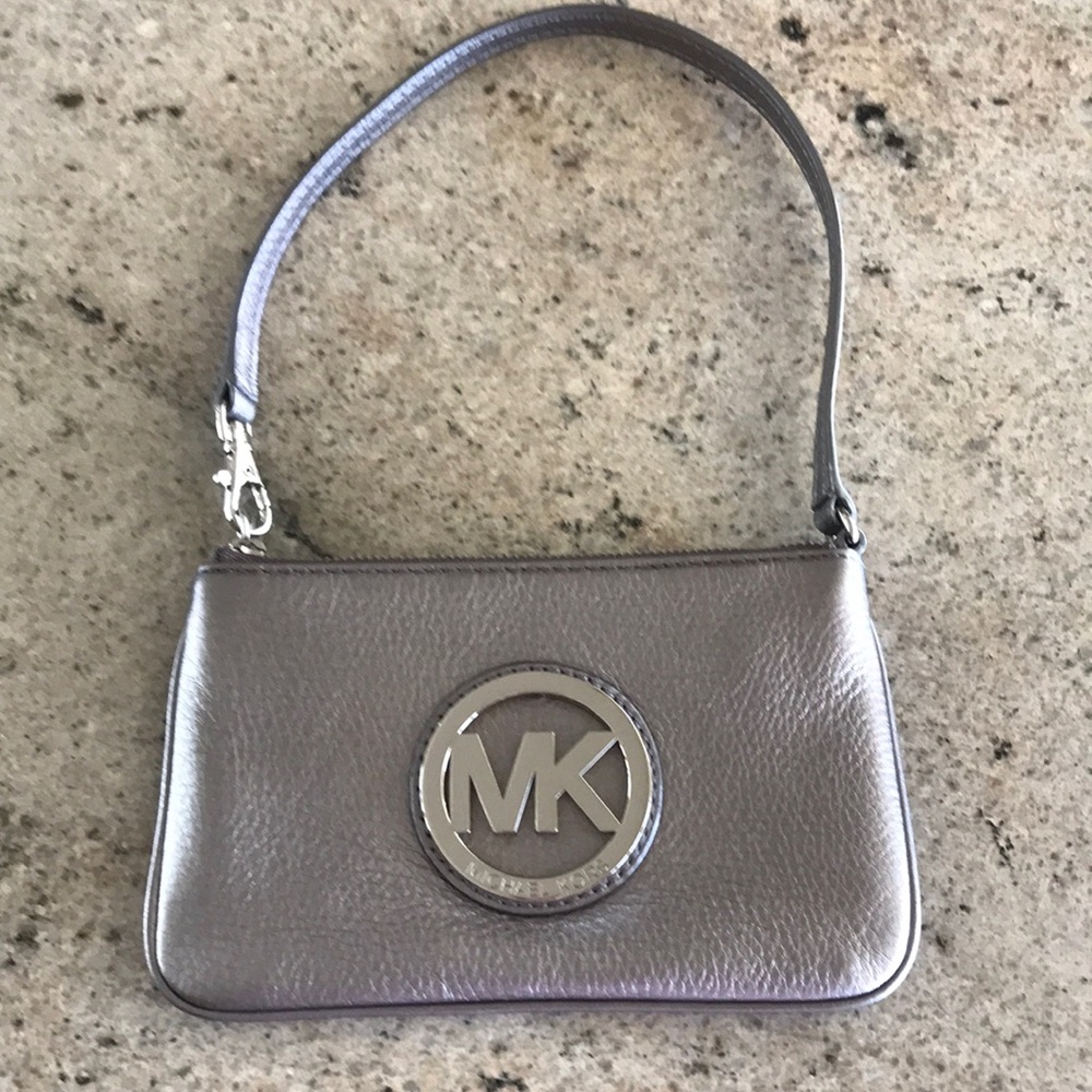 Metallic pebbled leather wristlet; silver hardware; EUC; two interior pockets.